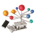 The 4M Green Science Kit - Solar System by 4M is an educational green science kit that includes a mechanical solar system model with colorful planets mounted on metal arms. Each arm is of a different length, supporting a uniquely colored and sized planet. The base of the hybrid planetarium features gears and a small solar panel.