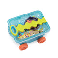 The Battat Beach Wagon with Toys, from the renowned brand Battat, features a blue plastic body filled with colorful sandcastle toys and is equipped with a wavy yellow handle and orange wheels. The transparent wagon body allows kids to see all their fun beach treasures inside.