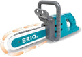 A Brio Builder Chainsaw toy, featuring a blue and gray color scheme, is shown. The chainsaw includes a handle with a protective guard and a simulated moving blade marked with arrows to indicate motion. The BRIO quality logo is visible on the blade, and the design incorporates safe, rounded edges for children's play.