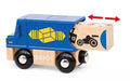 The Brio World Delivery Truck by Brio is shown in blue with black wheels. It features a wooden rectangular cargo section adorned with two yellow arrows and a yellow box symbol on its side. A wooden block with black machine illustrations extends from the cargo area, marked by a double-headed red arrow, making it perfect for any BRIO World setup.