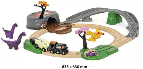 The Brio World Dinosaur Adventure Set, by Brio, is a children's toy train set with an exciting dinosaur theme. It includes a circular wooden track with a gray bridge, a black train with orange and white accents, dinosaur figurines, and vibrant scenery elements such as trees and rocks. Dimensions: 635 x 630 mm.