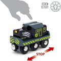 A Brio World Dinosaur Battery Train labeled "Brio" with EP-114 on the side, featuring a headlight and running on tracks. A hand silhouette points to where a 1x AA battery (not included) is placed, with an icon indicating battery needs. A red arrow below shows the "STOP" direction.