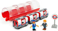 The Brio World London Underground Train by Brio features a London Underground Train with three connected carriages, two toy figures (one in a blue uniform and another in formal attire), and a circular 'Underground' sign. The train is black, red, and white with a transparent red tunnel cover.