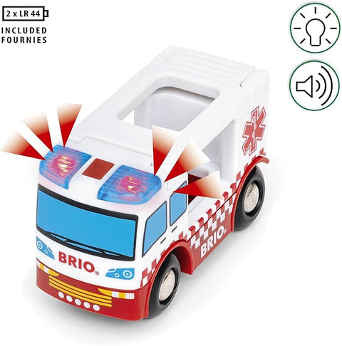 The Brio World Rescue Ambulance toy, branded "Brio," features red and blue flashing lights on top. It has black wheels, a white body with red-and-white checkered patterns, a red medical symbol on the side, and working sirens. Icons illustrate its light and sound capabilities. The product includes 2x LR44 batteries.