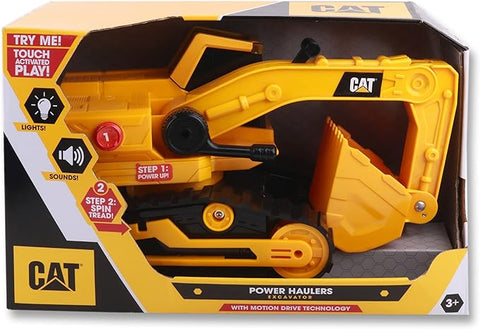 The image shows a CAT Power Haulers - Excavator toy from the brand CAT in its packaging. The yellow excavator with black detailing is designed for children aged 3 and up. The packaging highlights interactive play features such as touch-activated lights and sounds, along with Motion Drive Technology.