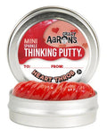 A small, round tin labeled "Crazy Aarons Thinking Putty - Heart Throb Mini" contains red, sparkly, non-toxic putty. The label reads "Mini Sparkle Heart Throb Thinking Putty" with spaces for "To:" and "From:". Suitable for ages 3 and up, this putty is another hit from Crazy Aarons.