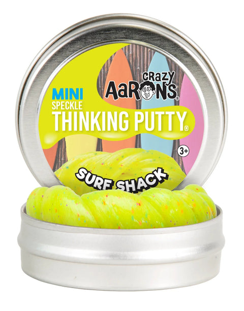 An open tin of Crazy Aarons Thinking Putty - Surf Shack Sparkle Mini reveals a vibrant yellow putty adorned with neon flecks. The lid features a surfboard design and notes it's suitable for ages 3 and up.