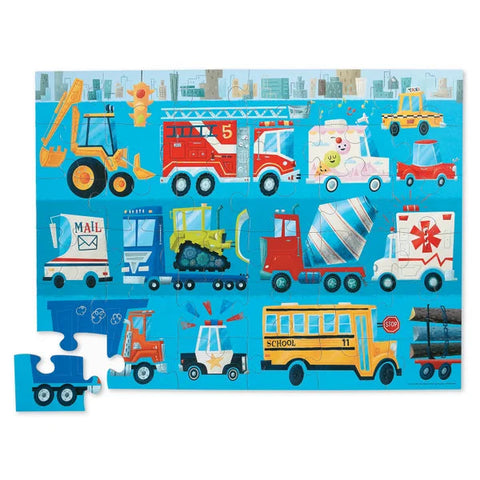 A vibrant Crocodile Creek 36-piece floor puzzle featuring a fire truck by Crocodile Creek. This vehicles-themed jigsaw puzzle includes a school bus, fire truck, ambulance, police car, mail truck, cement mixer, bulldozer, tow truck, tractor, and car transporter. Currently, two pieces are missing from the puzzle.