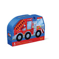 Image of the Crocodile Creek 36pc Floor Puzzle - Fire Truck. The packaging, designed to resemble a fire truck, is predominantly red and blue with illustrations of a cartoon fire truck. This delightful jigsaw puzzle features ladders, windows, and other captivating details.