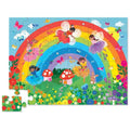 The Crocodile Creek 36pc Floor Puzzle - Rainbow from Crocodile Creek features a whimsical garden scene with fairies in vibrant dresses dancing under an arching rainbow. The colorful jigsaw puzzle includes delightful details such as mushrooms, flowers, butterflies, and a fawn. Notably, one puzzle piece showcasing strawberries is separated from the completed image.