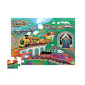 The Crocodile Creek 36-piece Foil Floor Puzzle - Puzzle All Aboard from Crocodile Creek features a vibrant series of trains navigating through a lush, mountainous landscape. Among the trains, one has a bright yellow and red engine numbered '42,' while another blue train with a star emerges from a tunnel. The colorful illustrations are housed in a uniquely shaped storage box, adding charm to every piece.