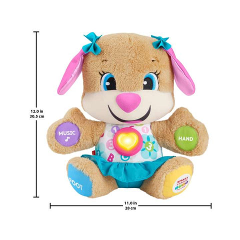 The Fisher-Price Laugh & Learn Smart Stages Sis by Fisher-Price is a 12-inch tall, 11-inch wide musical plush toy dog. It features a smiling face and wears a turquoise skirt with matching bows, complemented by pink ears and colorful buttons labeled 'Music,' 'Hand,' and 'Foot' on its paws. This toy includes Smart Stages technology for enhanced baby learning.