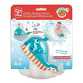 The image showcases the HAPE Bubble Maker Whale bath toy in its packaging. The cheerful blue whale, adorned with orange and white stripes, is designed for children aged 18 months and up. The packaging features an illustration of a child enjoying bath time while blowing bubbles, along with product instructions.