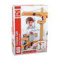 The image showcases a Hape Crane Lift toy set box, featuring a cheerful child engaged in imaginative play with the crane set, which boasts vibrant yellow and orange colors with a grey base. Ideal for children ages 3 and up, this set includes 10 pieces to bring any construction scenario to life. The tagline reads, "Love play. Learn.