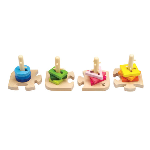 The Hape Creative Peg Puzzle by Hape is a wooden shape sorting puzzle featuring four separate pieces, each with a peg holding various colorful shapes. These vibrant shapes include circles, squares, pentagons, and hexagons, designed to enhance fine motor skills and boost problem-solving abilities.