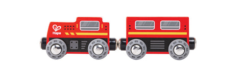 A red wooden toy train with two cars from the Hape Play Essentials Classic Figure 8 Set, featuring four gray wheels on each car and black connectors. Part of the Hape railway collection, it boasts yellow and black stripes, a heart logo, and "Hape" on the front car. The design is completed with white and gray windows, offering an ultimate railway experience.