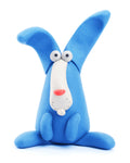 A whimsical, bright blue rabbit figurine from the Hey Clay 15 pack - Animals collection by Hey Clay, sitting upright with large floppy ears, wide eyes, a small pink nose, and a puzzled expression. The playful and cartoonish style gives it a charming, handcrafted look perfect for play-based learning sessions.