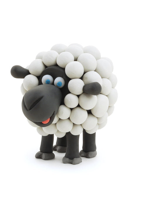 A charming clay sheep model with a fluffy, rounded white body made of small spheres and black head and legs, created using the Hey Clay 15 pack - Animals from Hey Clay for play-based learning. The sheep boasts blue eyes and a red tongue sticking out, all set against a white background.