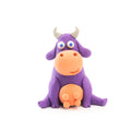 From the Hey Clay 15 pack - Animals by Hey Clay, a charming and playful cow figure crafted from purple and orange clay sits on a white background. The cow features big round eyes, grey horns, an orange nose, and udder, and appears to be happily smiling—ideal for encouraging play-based learning.