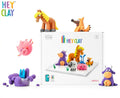 A picture showcasing the Hey Clay 15 pack - Animals set highlights an array of vibrant modeling clay cans and a charming collection of animals, such as a horse, dog, pig, cow, and sheep. These cute figures are positioned both in front of and on top of the product box. The Hey Clay logo is prominently displayed in the top left corner, emphasizing play-based learning brought to you by Hey Clay.