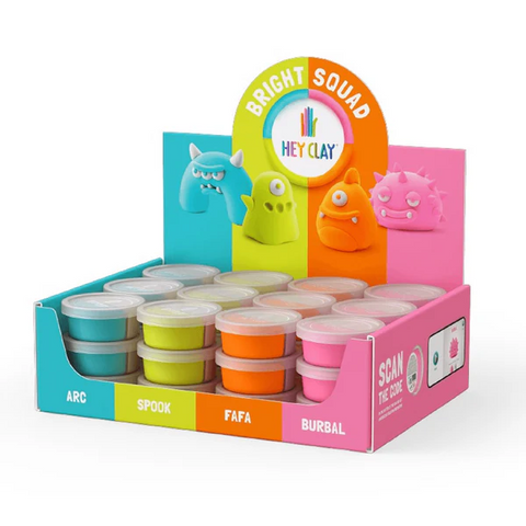 The Hey Clay Bright Squad display box features individual cans of Hey Clay brand modeling clay. The packaging is divided into sections labeled Arc, Spook, Fafa, and Burbal, each showcasing a small creature model with corresponding clay containers underneath. It boasts colorful packaging complete with sculpting instructions and a QR code on the right side.