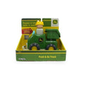 Image of a baby toy in green and yellow packaging. The vehicle resembles a tractor with a driver, and the text on the box reads "John Deere Push N Go Truck" and "John Deere." Suitable for ages 12 months and up, it encourages crawling. The brand ERTL is also visible.