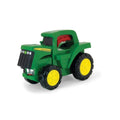 A John Deere Roll & Go Flashlight featuring a green body with yellow wheels and a prominent John Deere logo on the front. The flashlight, designed to look like a sturdy tractor, features engine sounds and has a large body with a detailed cab area and distinct black grille above the front wheels. The tires are thick and rugged.