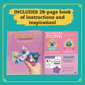 An open instructional book titled "Klutz Enchanted Fairy House" by KLUTZ is displayed against a teal background. The left page features the cover with enchanting fairy doll figurines, showcasing a whimsical crafting kit. The right page highlights a "Hair Salon" section. A yellow text emphasizes that it "INCLUDES 28-page book of instructions and inspiration!