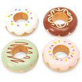 Enjoy Le Toy Van Doughnuts, a set of four solid wood doughnuts by LE TOY VAN. Each unique doughnut is beautifully decorated: one with white icing and colorful sprinkles, another with brown icing and yellow lines, a third featuring green icing and brown stripes, and the last adorned with pink icing and colorful sprinkles. All come elegantly presented in a charming window gift box.