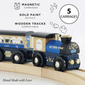 A wooden toy train with 5 carriages travels on a curved wooden track. Named the "Le Toy Van Twilight Train" and crafted by LE TOY VAN, it features gold paint details and magnetic carriages. Made from sustainable rubberwood, the image highlights its "Hand Made with Love" craftsmanship and compatibility with wooden tracks.