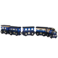 The LE TOY VAN Twilight Train is a vintage-style wooden toy train featuring a blue and black color scheme. It includes an engine and three passenger cars made from sustainable rubberwood, each adorned with painted windows and decorative details. The cars roll smoothly on black wheels connected by metal axles.