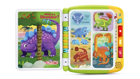 The Leapfrog Touch & Learn Dinosaur Book from Leapfrog is an interactive children's book featuring colorful illustrations. On the left page, the text reads "What is a Dinosaur?", accompanied by fun facts and labeled dinosaurs. The right page also includes more labeled dinosaurs along with interactive buttons for audio and light features.