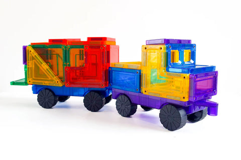 The Learn & Grow Rainbow Magnetic Tiles Car Expansion Pack 28pc from Learn & Grow Toys features a vibrant toy truck made of colorful interlocking plastic tiles. The truck includes a purple front cab, a yellow driver area, a blue mid-section, and a red and green rear cargo section with rubber wheels. This attractive set is displayed against a white background.