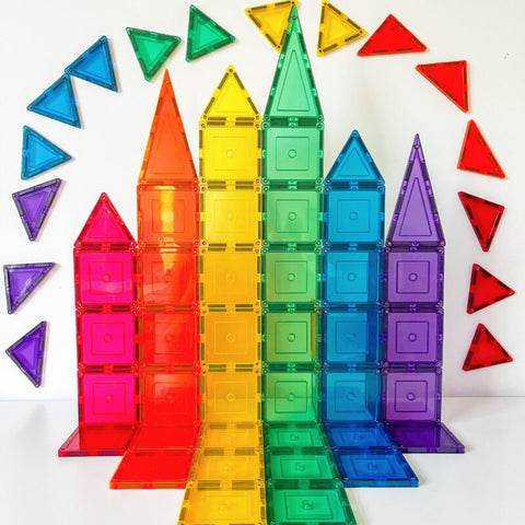 The Learn & Grow Rainbow Magnetic Tiles Small Square Pack 36pc creates a vibrant and educational structure organized in a rainbow gradient, perfect for hands-on learning. Featuring small square tiles in vivid colors such as red, orange, yellow, green, blue, and purple—along with additional triangle pieces forming a partial circle around the structure—this set is an excellent way to build STEM skills.