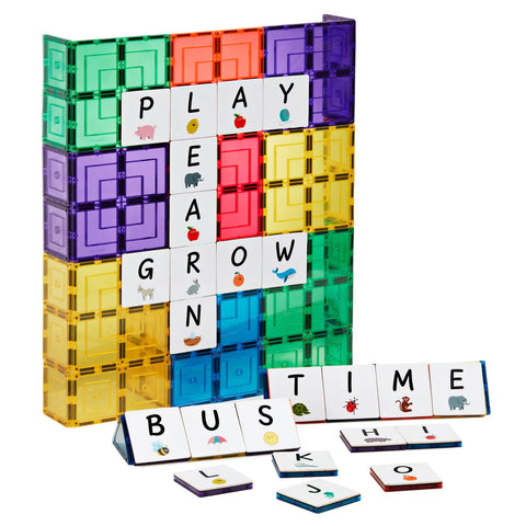 The image displays a vibrant Learn & Grow Rainbow Magnetic Tiles Toppers - Alphabet Upper Case Pack 40pc set, arranged to spell words like "PLAY," "LEARN," "GROW," "BUSH," and "TIME" on a vertical board. Ideal for early literacy instruction, the Alphabet Upper Case tiles showcase letters alongside small images, with extra tiles conveniently placed in a holder at the bottom.