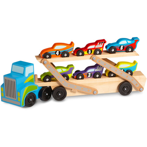 The Melissa & Doug Mega Race-Car Carrier by Melissa & Doug is a colorful wooden car carrier transporter truck that comes with six vibrant race cars. The truck features a detachable double-deck trailer and boasts a blue cab. Each race car is uniquely painted in bright colors and numbered, resting on two levels of the trailer, making it perfect for honing motor skills.