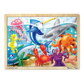 The Melissa & Doug Wooden Jigsaw Puzzle - Under The Sea 24pc features an underwater scene with various sea creatures, including a jellyfish, swordfish, shark, seahorse, crab, octopus, and fish among corals and sea plants. The puzzle's border has a light wood finish with the text "crafted by hand ~ Melissa & Doug" visible on this ocean life puzzle.