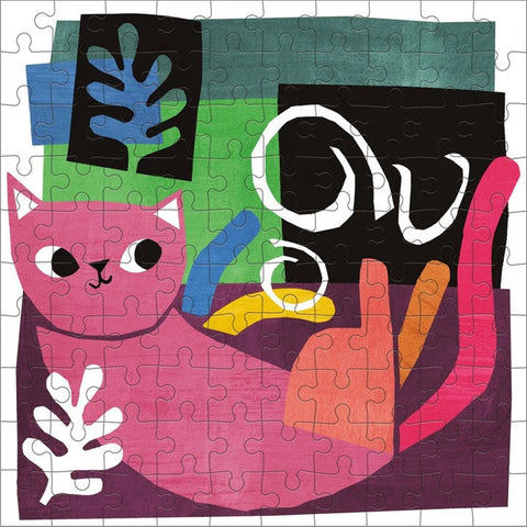 The Mudpuppy Artsy Cats Puzzle Tin - Henri Catisse by Mudpuppy is a vibrant 100-piece puzzle showcasing an abstract portrayal of a pink cat adorned with a white leaf shape on its body. The backdrop is filled with assorted shapes in hues of green, blue, and black, highlighted by a striking white swirl and an orange detail intertwined with the cat, evoking imagery akin to scenes from a paint can tin.