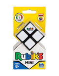 An image of the Planet Fun Rubiks 2x2 Mini puzzle in its packaging. The yellow and white package features the Rubiks logo prominently and indicates that the puzzle is suitable for ages 8 and up, complete with a challenge level meter. The mini cube, visible through the packaging with white squares, promises a smoother mechanism for enhanced gameplay.