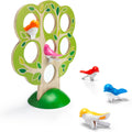 The Smart Games 5 Little Birds set by Smart Games features a wooden tree puzzle adorned with green leaves and circular cutouts, all situated on a green base. The set includes colorful plastic birds in orange, pink, red, blue, and yellow that can be placed in the cutouts or scattered around the base. This engaging toy helps develop cognitive skills and is perfect for kids who love playing games like Flock Together.