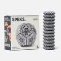 A box labeled "Speks" displaying a photo of a magnetic fidget sphere and the description "geode." Next to the box is a stack of flat, hexagonal, and magnetic pentagon pieces from the Speks Slate Magnetic Pentagons - Set of 12^, showcasing how this desk toy's components can be assembled.