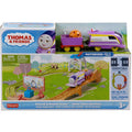 The image shows a boxed Fisher-Price toy set called "Thomas & Friends Motorized Engine - Round & Round Kana." The set includes a motorized train, tracks, and various accessories. The packaging displays colorful illustrations of the toy in action, indicating it is suitable for ages 3 and up.