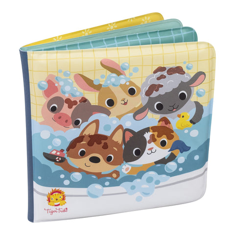 The Tiger Tribe Bath Book - Messy Farm is a vibrant children's bath book featuring cartoon illustrations of various animals—pig, rabbit, lamb, dog, cat, and duck—all playing together in a bubbly bathtub. Enjoy the bath time fun with this playful story! The cover sports the TIGER TRIBE logo in the bottom left corner.