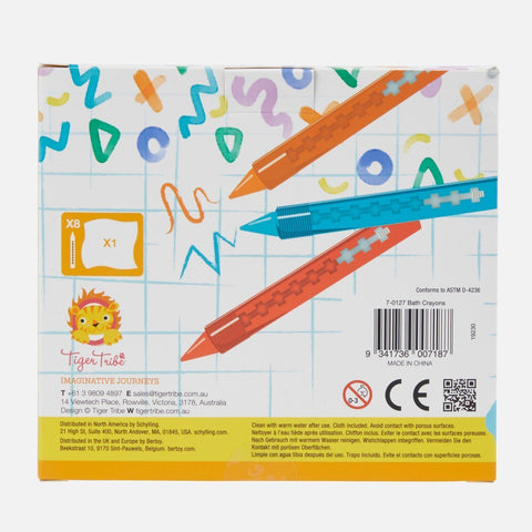 The image showcases the back packaging of TIGER TRIBE Bath Crayons, ideal for encouraging Creative Play and developing Fine Motor Skills. The background is adorned with vibrant, playful doodles. Three crayon illustrations are visible, along with product information in multiple languages at the bottom. A barcode is situated on the right side.