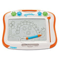 A Kinderboard Tomy Megasketcher magnetic drawing board displays charming sketches of a dinosaur and a tree. Designed for mess-free drawing, the board features an orange and white frame with blue and green buttons at the top, along with an attached blue and orange magnetic pen on the right side.