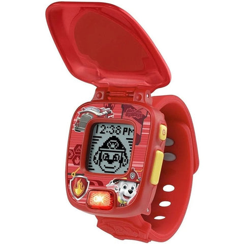 The VTech Paw Patrol Marshall Learning Watch, available in red, showcases beloved characters and icons from the animated series "Paw Patrol." This digital wristwatch includes a protective flip cover, a digital screen for time display, and multiple buttons for engaging problem-solving games. The strap features multiple holes to ensure an adjustable fit.