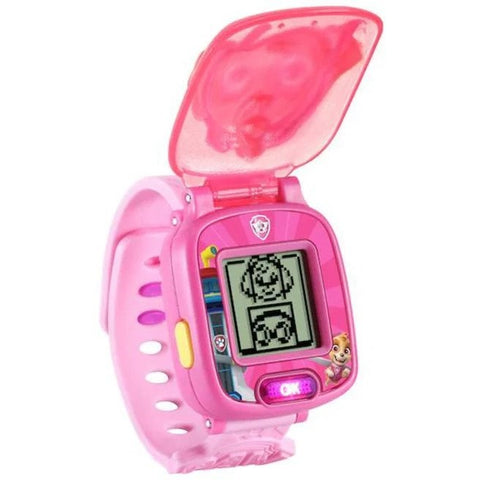 Introducing the VTech Paw Patrol Sky Learning Watch—a pink children's smartwatch featuring a flip cover adorned with cartoon characters from Paw Patrol. The watch displays pixelated images on its screen and includes a small button at the bottom. Plus, it offers problem-solving games to enhance math skills, making learning fun!