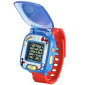 The VTech Spidey Learning Watch by Vtech is a kids electronic wristwatch with a colorful design featuring Spider-Man. It has a blue body with a transparent flip cover, a red wrist strap, and a small black-and-white digital screen displaying pixelated graphics. A yellow button labeled "OK" is on the front.