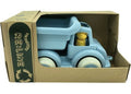 The Viking Toys Re:Line Jumbo Tipper Truck, a sturdy light blue vehicle with white wheels, arrives packaged in a cardboard box adorned with the "Re:Line" label and recycling symbol. Crafted from recycled plastic, this truck includes a small yellow figure in the driver's seat, making it ideal for developing motor skills.