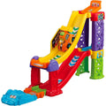 The Vtech Toot-Toot Drivers 3-in-1 Raceway by Vtech is a vibrant toy car ramp made up of bright red, yellow, green, purple, and blue sections. At the top of this exciting raceway sits a SmartPoint racer ready to zoom down the steep slide. Multiple supports ensure a fast and thrilling ride for every fan of the Toot-Toot Drivers Raceway.